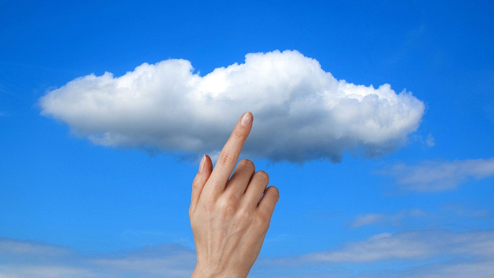 finger touching a cloud